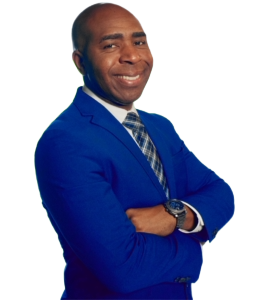 a african american man in a blue suit and tie arms folded and smiling