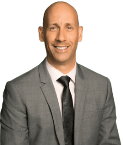 a man in a suit and tie smiling