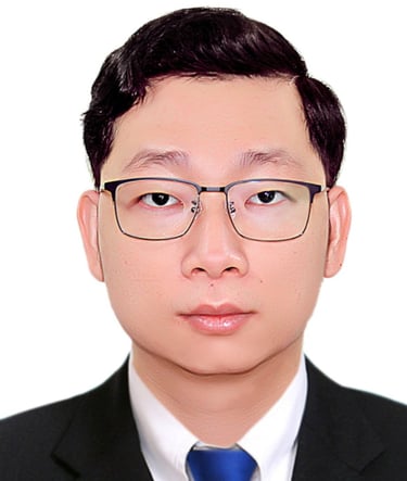 a man in a suit and tie with glasses