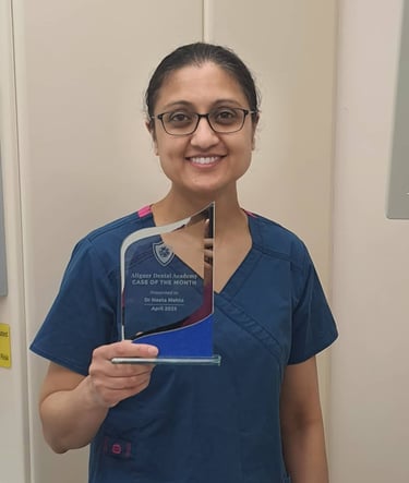 a woman in scrubs and scrubs holding a plaque