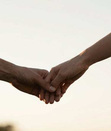 A minimalist vertical composition on a pure white background. A thin vertical sliver of a cinematic image shows a couple's hands gently intertwined, bathed in golden morning light. Sophisticated and airy.