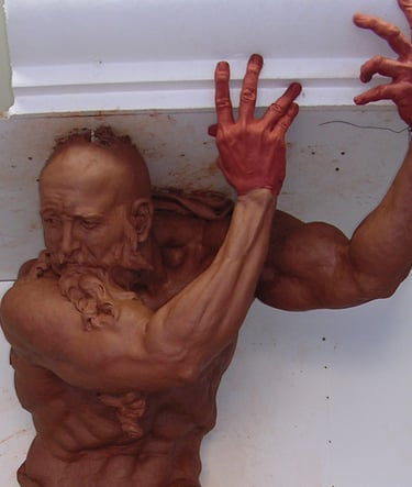 A detailed clay sculpture of a muscular bearded man holding up a white ceiling molding.. Atlante