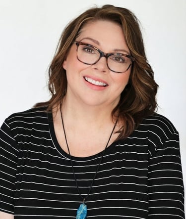 a woman with glasses and a necklace on her neck