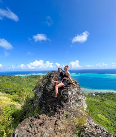 Manon and Laurent admiring the breathtaking view of the blue lagoon in Bora Bora, French Polynesia.
