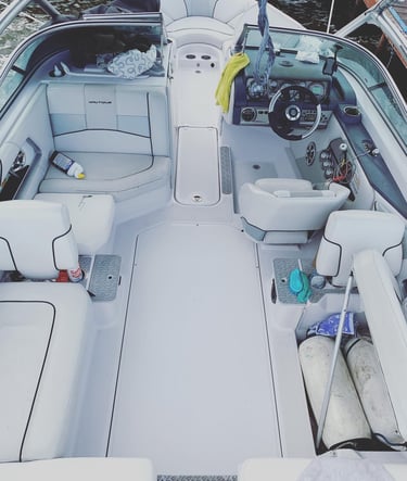 Boat interior before SeaDek flooring upgrade – worn factory deck prior to Vital Marine installation 