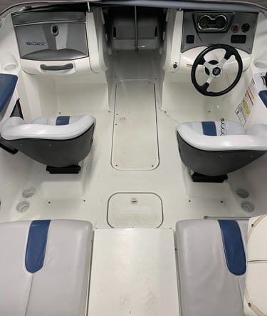 Boat interior before SeaDek installation showing worn factory flooring prior to Vital Marine upgrade