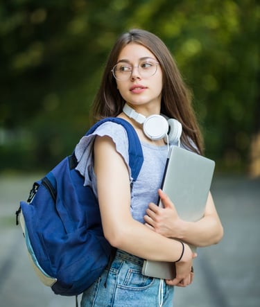 a woman with headphones and a backpacker