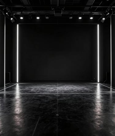 A wide-angle shot of a minimalist stage in a modern North American venue. The floor is polished black, featuring vertical silver neon pillars that cast sharp light. The atmosphere is edgy and high-performance.