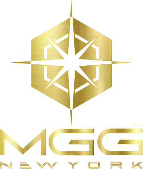 MGG New York brand logo in metallic gold, featuring a compass-style star icon inside a hexagon