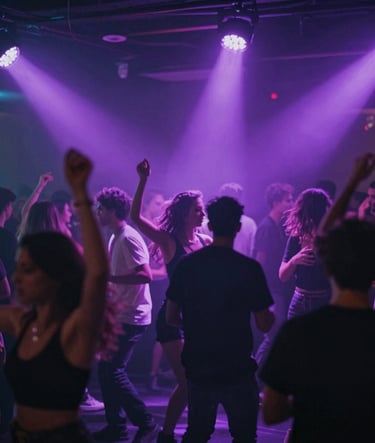 A wide shot of a crowded dancefloor in a sophisticated high-end club, motion blur on dancers, vibrant purple light rays cutting through haze, energetic nightlife vibe, #2C2D3B and #E0E0EB highlights.