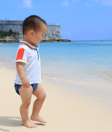 baby on a beach in bermuda