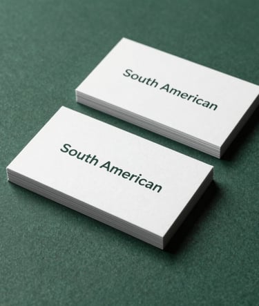 A close-up photograph of premium business card mockups with minimalist typography, arranged neatly on a dark green textured surface. Professional lighting with soft shadows, sophisticated South American corporate style.