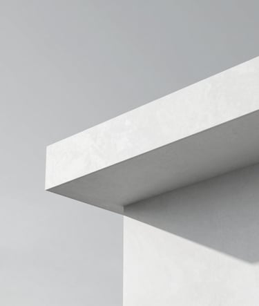 Close-up of a minimalist architectural structure featuring clean, sharp lines of white concrete against a pale gray sky (#D8D8D8). The composition is geometric and balanced, emphasizing luxury and structural precision. No distracting elements, just light and shadow.