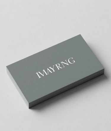 A sleek business card mockup resting on a clean minimalist surface, featuring elegant typography. The composition conveys a sense of refined creativity and meticulous attention to detail. Styled with subtle tones of slate grey and sage green, evoking a sophisticated brand presence.
