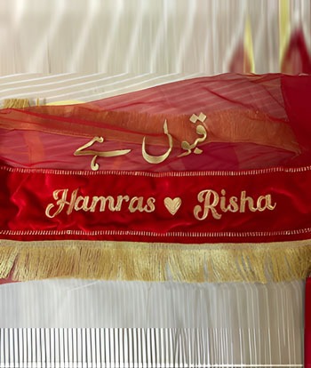 a banner hanging from a curtain in a room
