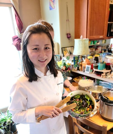 Chef Mia holding fresh spring salad with roasted mushroom. Gluten-free chef, private chef Portland.