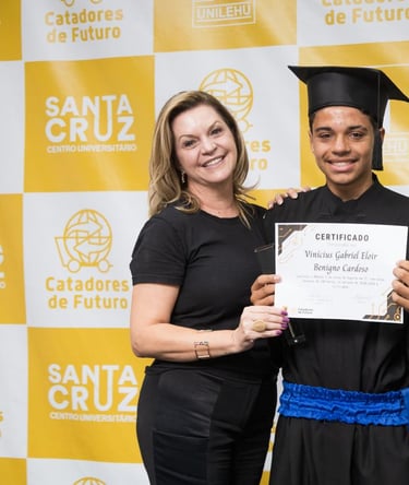 a man and woman in black and white graduation gowns