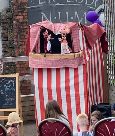 Carl the Magician Traditional Punch and Judy puppet show at a festival 