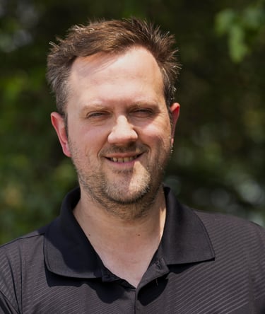 a man with a beard and a black shirt