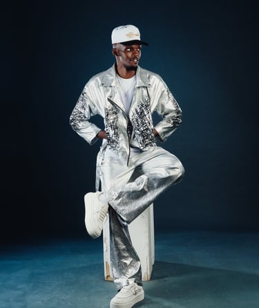 Amapiano Odi Dance and Beginner teacher Flex of TheOne Studios in Nairobi, in a shiny outfit