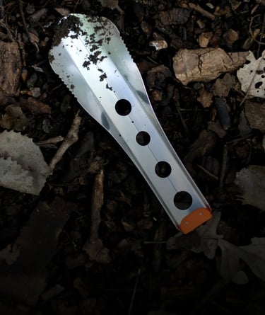 boglerco trowel lying on leafy ground