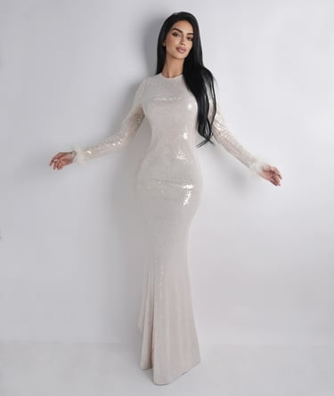Dynamic standing pose showcasing personality and style, framed in a modern studio setting.