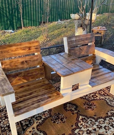 Simple wooden garden bench used as outdoor seating, bringing warmth, comfort and natural texture to