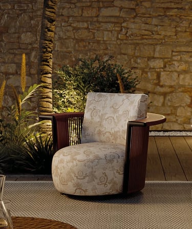 Comfortable outdoor seating with patterned cushions, natural textures and lounge chair design for re