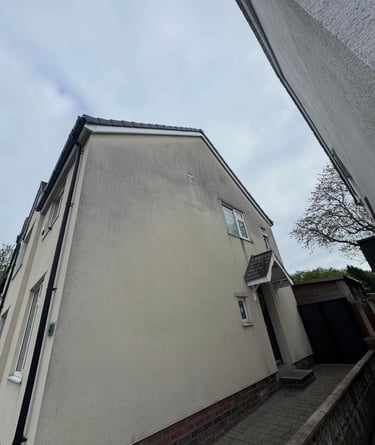 before and after photo of render cleaned by webster exterior in blackpool