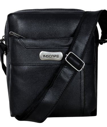 a black leather sling bag with a metal buckle