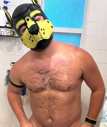 Man in shower wearing a pup mask. @goodpup_jax