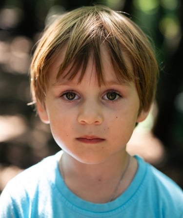 Four year old white boy with a serious face