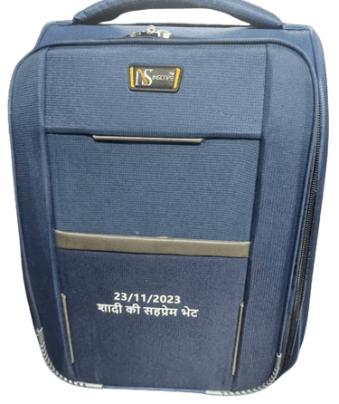 a blue suitcase with a quote on it