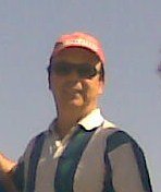 a man in a red hat and a blue shirt