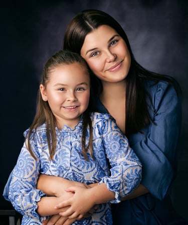 Mother and daughter embracing during a portrait session