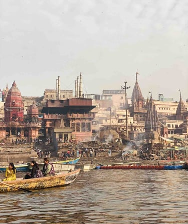 Traditional Hindu cremation ceremony taking place at Manikarnika Ghat in Varanasi, on the banks of the sacred Ganges River.