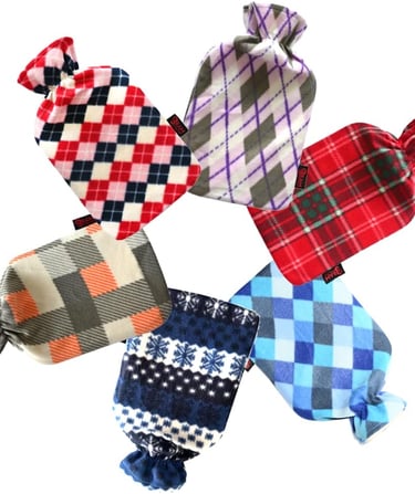 Six hot water bottles with soft fleece covers in various plaid, argyle, and snowflake patterns.