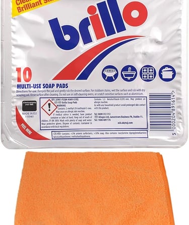 Pack of 10 Brillo multi-use steel wool soap pads for cleaning with an orange microfiber cloth.