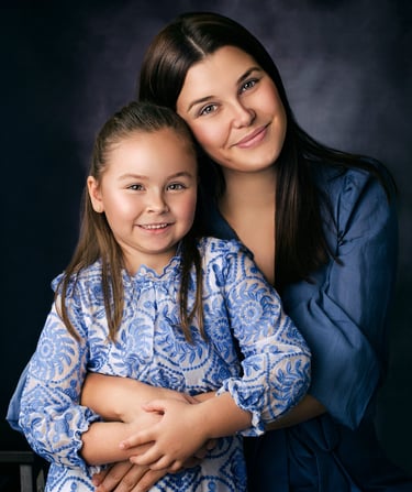Mother and daughter embracing during a portrait session