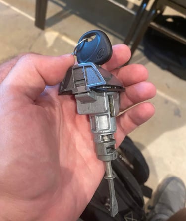 A man holding a key and door lock mechanism for a Hyundai