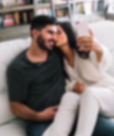 a man and woman sitting on a couch