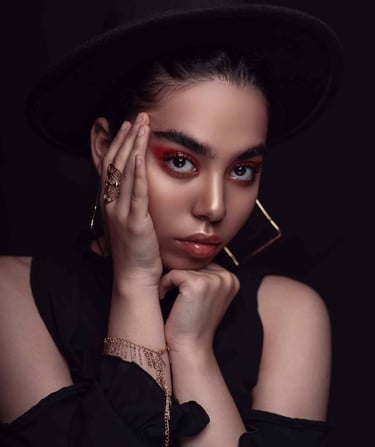 a woman with a stunning makeup and look