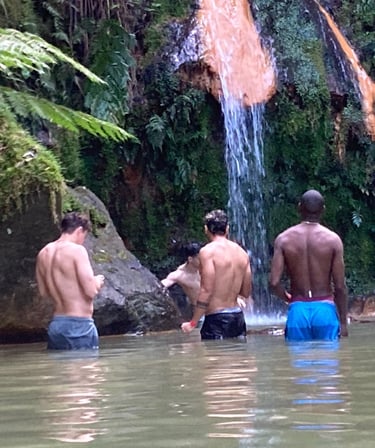 Men bathing together at a somatic bodywork event