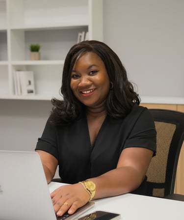 Angele Kasse, Founder of Local Ads Lab smiling and sitting in an office setting with a laptop