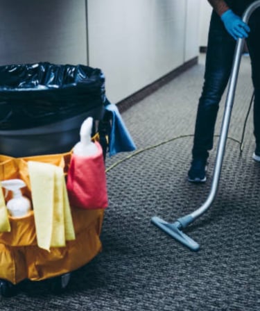 CoreBright vacuuming carpet.