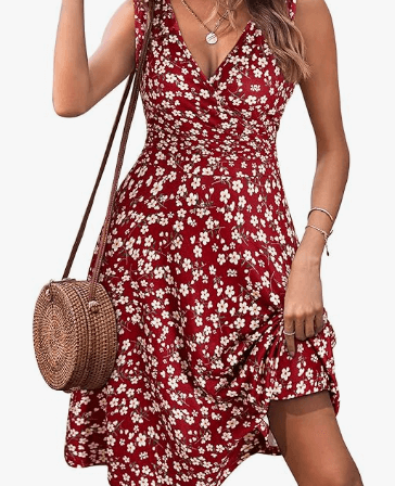 a woman in a red dress with a straw hat