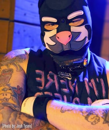 Man in a pup mask.
