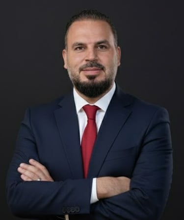 a man in a suit and tie with a red tie