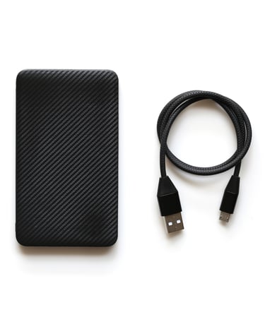 a black cell phone with a usb cable and a usb cable