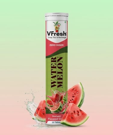 VFresh watermelon flavored effervescent drink tablets tube with fresh fruit slices and water splash.
